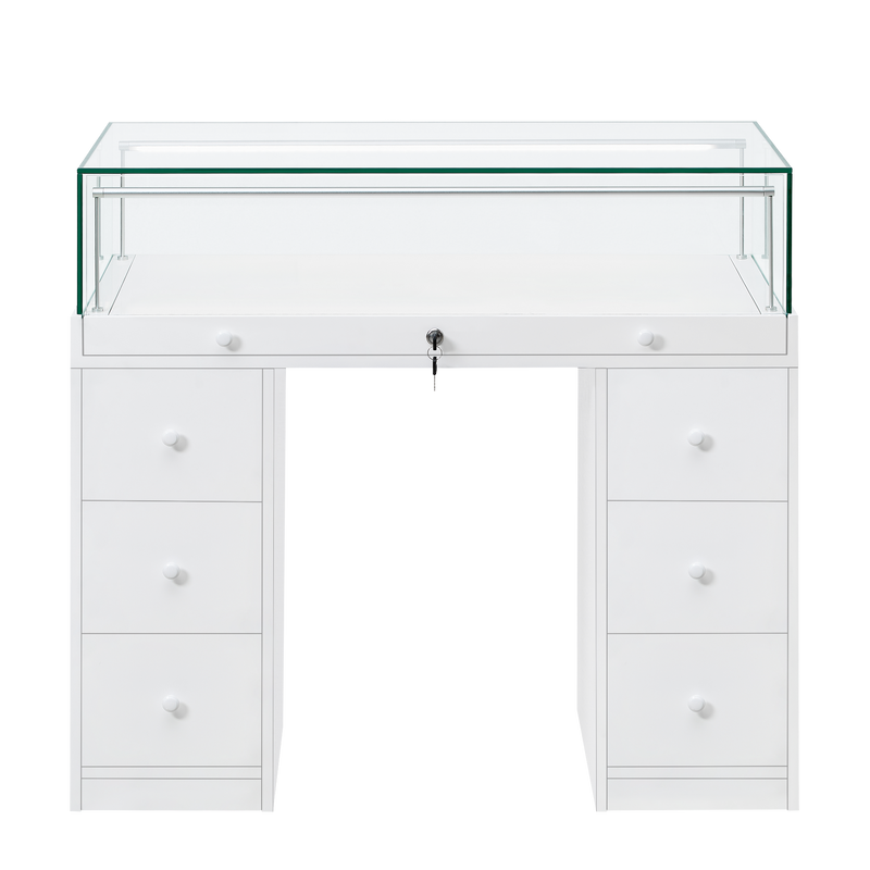 Load image into Gallery viewer, A white desk style retail display unit with a lockable glass top and storage drawers.