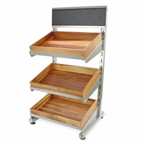 Low level metal display stand  with sloping shelving holding wooden trays on a white background
