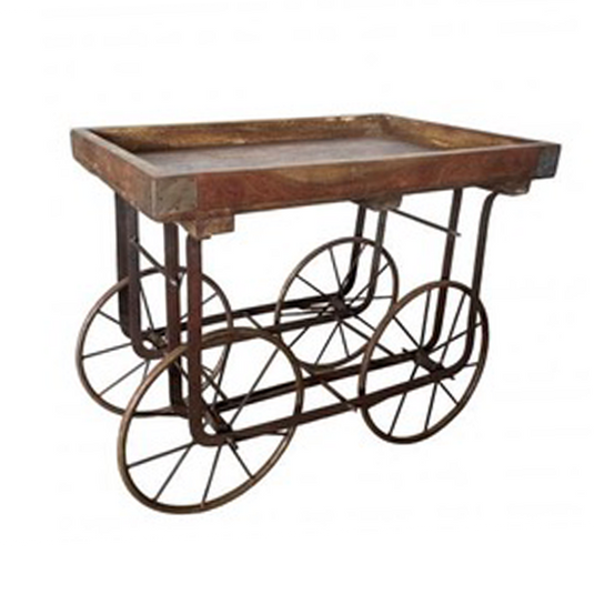 Small vintage-style rustic wooden cart with metal wheels on a white background