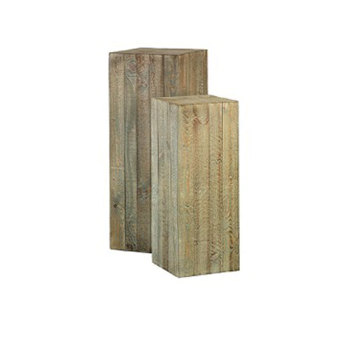 Two tall wooden plinths on a white background. 